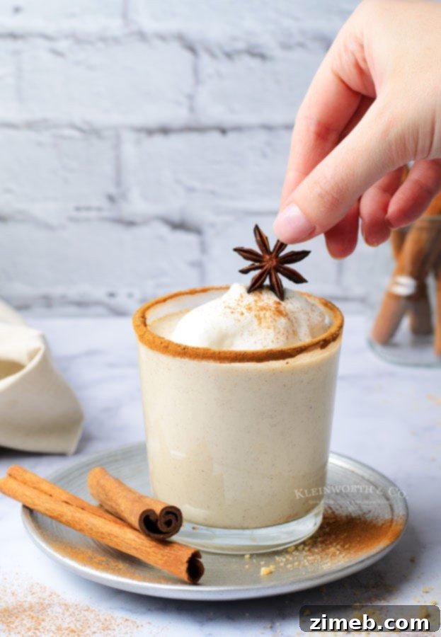 Timeless Homemade Eggnog 9 Classic Homemade Eggnog recipe, showcasing a delicious, frothy drink in a glass, ready for festive gatherings and cozy moments.