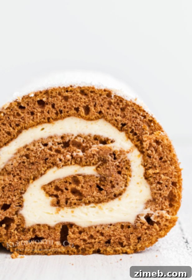 Decadent Pumpkin Roll with Bourbon Caramel Swirl 18 Bourbon caramel frosting being spread in a pumpkin roll cake