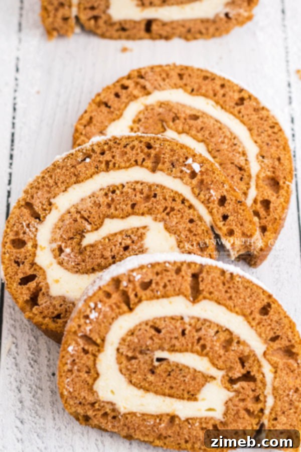 Decadent Pumpkin Roll with Bourbon Caramel Swirl 3 Slices of perfectly rolled pumpkin cake with creamy frosting