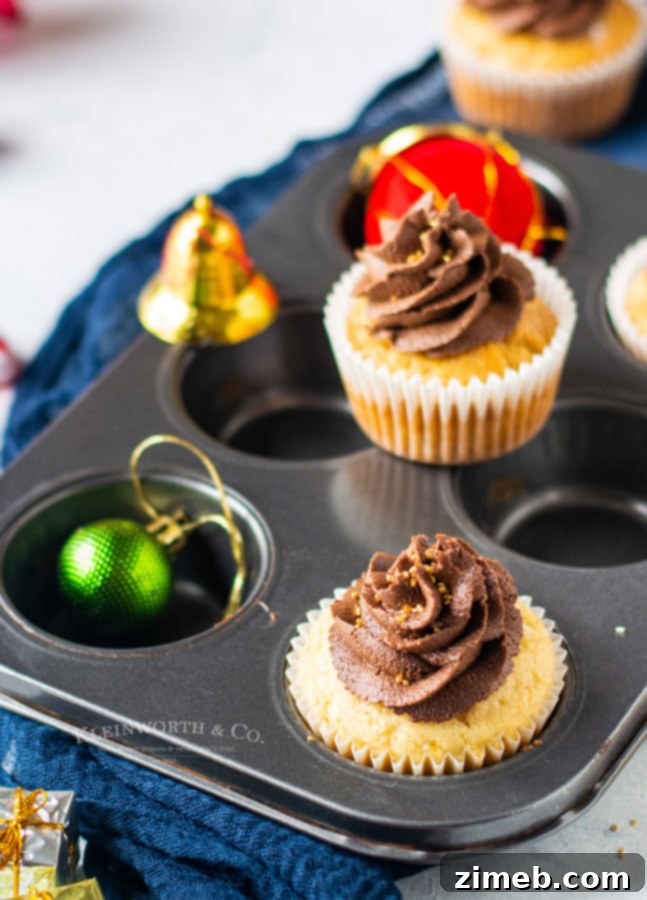 Festive Christmas party cupcakes with chocolate frosting and Nutella filling.