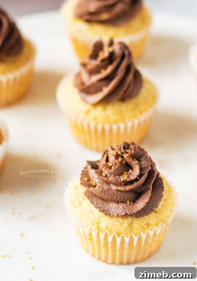 Vanilla cupcakes filled with Nutella, topped with chocolate buttercream, perfect for birthdays.