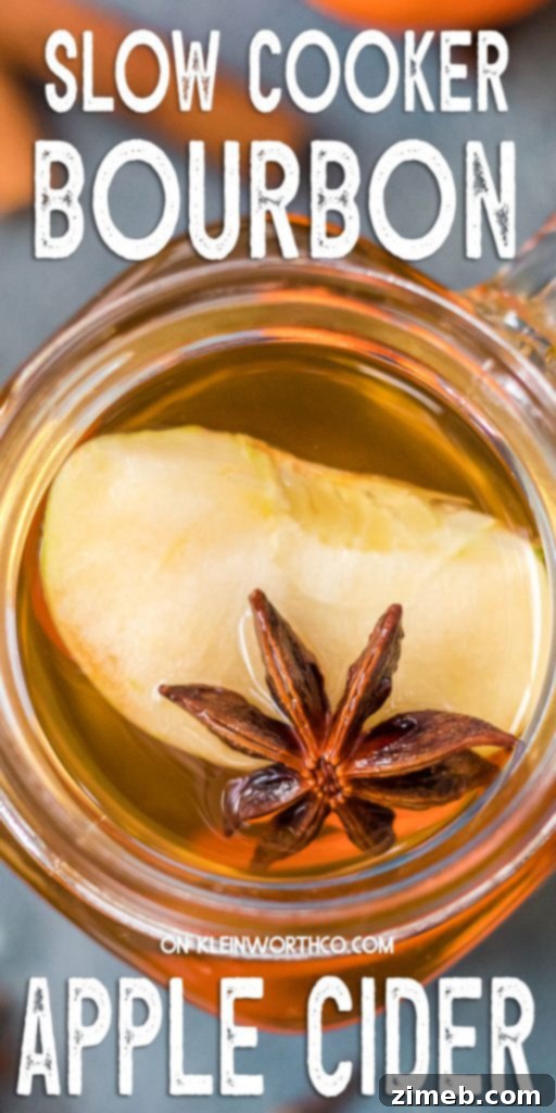 Golden Bourbon Apple Brew 2 Bourbon Apple Cider, a warm and spiced hot beverage in a slow cooker, perfect for gatherings.
