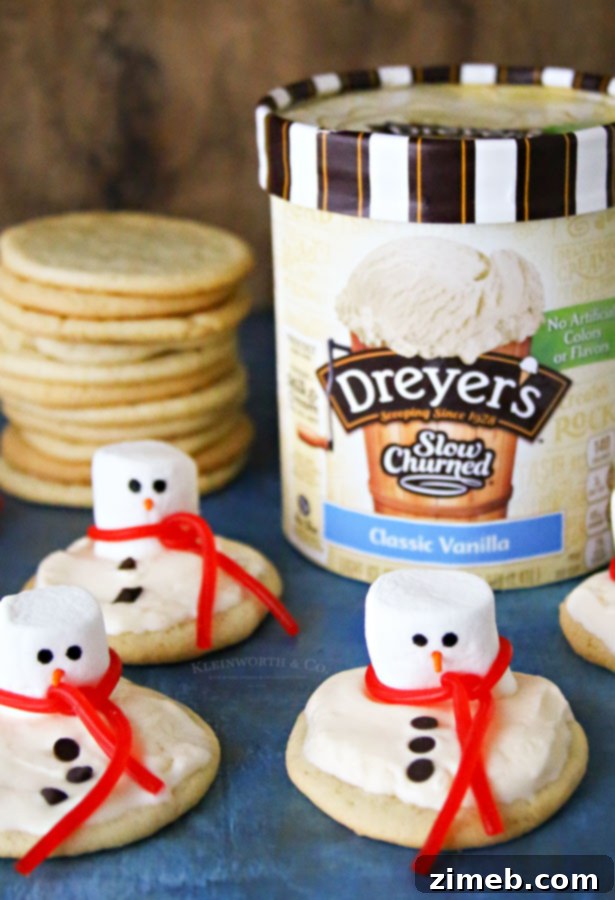 Frosted Snowman Meltdown Cookies 4 A close-up of a festive dessert, Melted Snowman Cookies, showing the details of the marshmallow snowman, ice cream 'puddle', and cookie base.