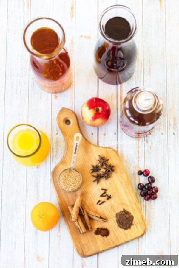 Ingredients to make Slow Cooker Wassail, including juices, spices, and optional brown sugar.