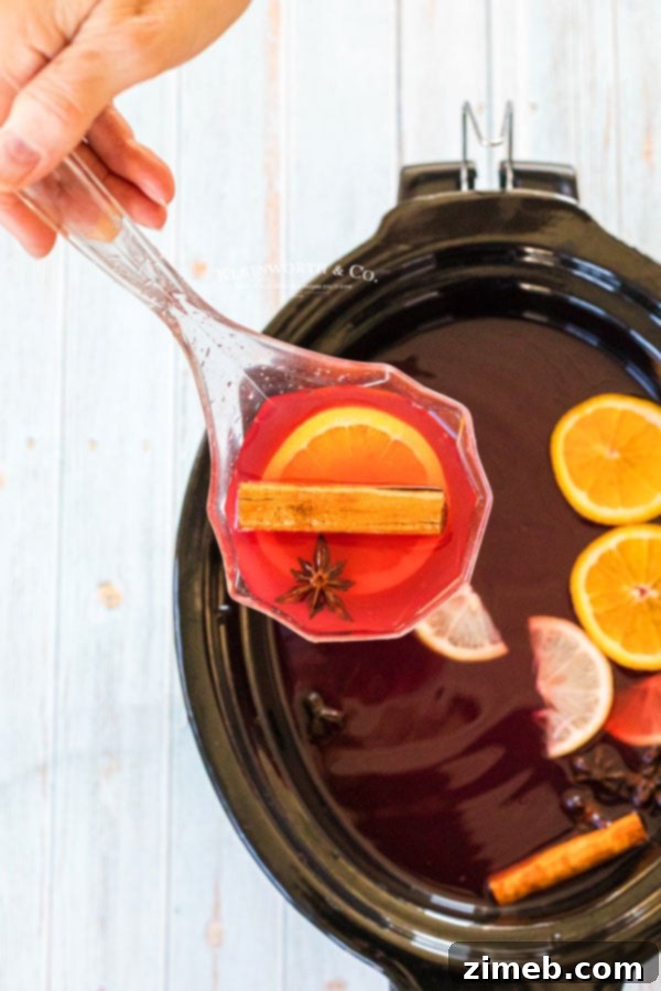 Recipe for Slow Cooker Wassail with a focus on preparation steps.