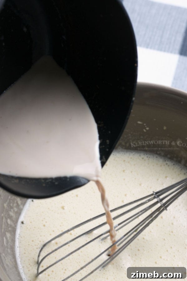 Pouring Homemade Non-Alcoholic Eggnog