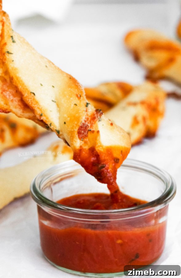 Pepperoni Pizza Bites 5 Freshly baked Pepperoni Pizza Dippers on a platter, ideal for tailgating or a party spread