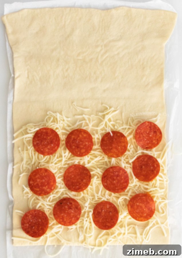Pepperoni Pizza Bites 7 Pizza dough folded over with pepperoni and cheese, cut into strips and twisted, ready for baking