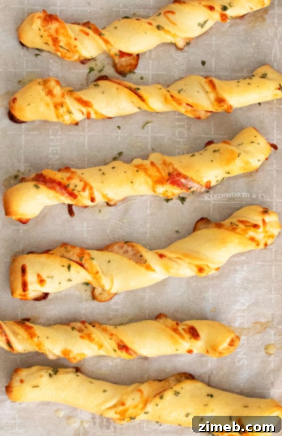 Pepperoni Pizza Bites 9 Golden brown, baked Pepperoni Pizza Dippers stacked on a plate, showing their crispy texture
