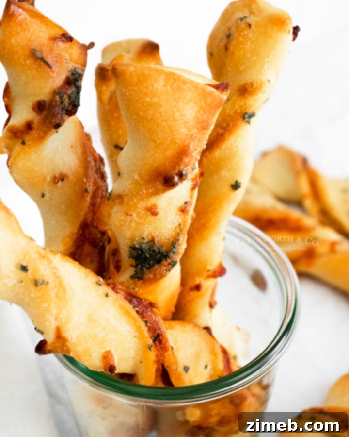 Pepperoni Pizza Bites 10 Pile of golden brown, twisted Pepperoni Pizza Dippers on a platter, ready to be enjoyed