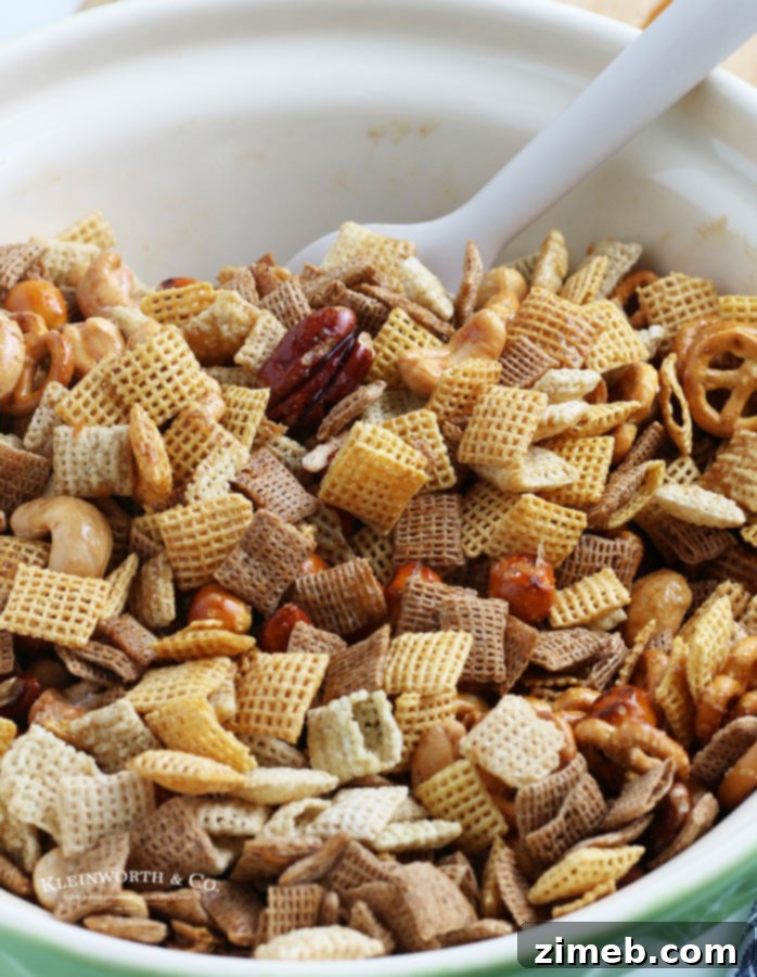 adding the sauce for party mix