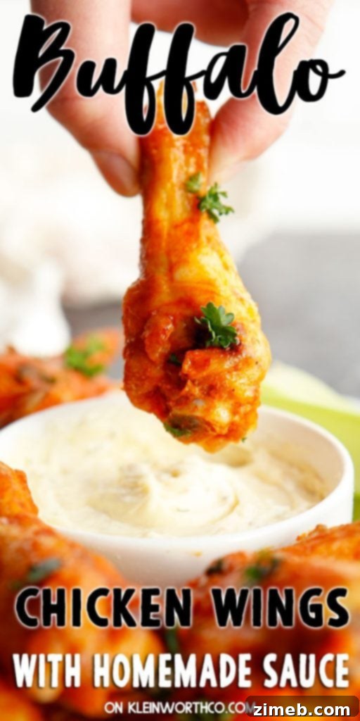 Ultimate Buffalo Wings 2 Buffalo Chicken Wings piled high, ready to serve, with a side of ranch dressing.