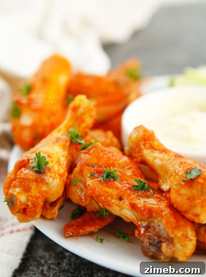 Ultimate Buffalo Wings 3 Perfectly baked chicken wings, golden brown and crispy, coated in buffalo sauce.