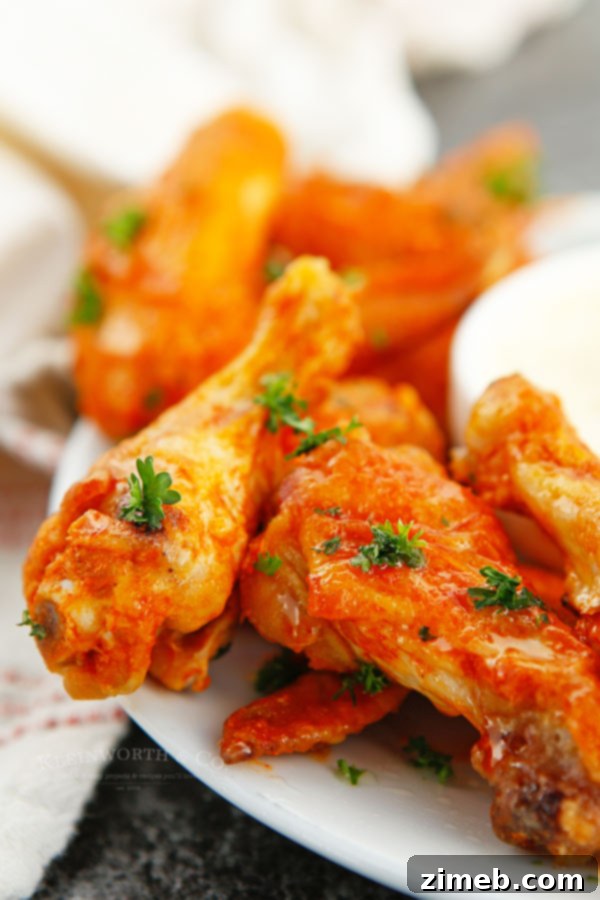 Ultimate Buffalo Wings 9 Game day chicken wings served with ranch dip and celery sticks.