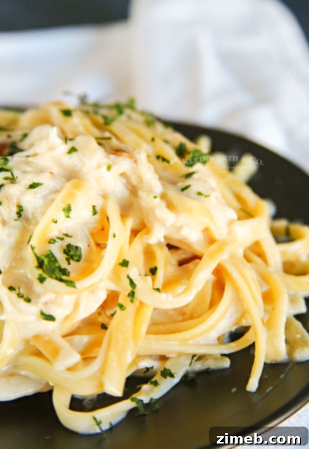 A large serving of Instant Pot pasta with Alfredo sauce.