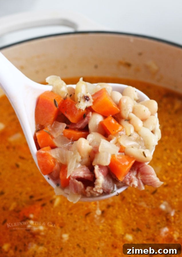 Serving a bowl of Ham and Bean Soup, ready to enjoy
