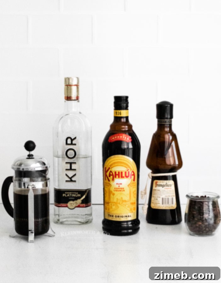 Ingredients for Espresso Martini Recipe, showcasing the liqueurs, espresso, and vodka.