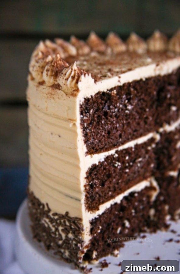 Rich Coffee Buttercream Frosting 22 A slice of espresso chocolate cake generously topped with Coffee Buttercream Frosting, ready to be enjoyed.