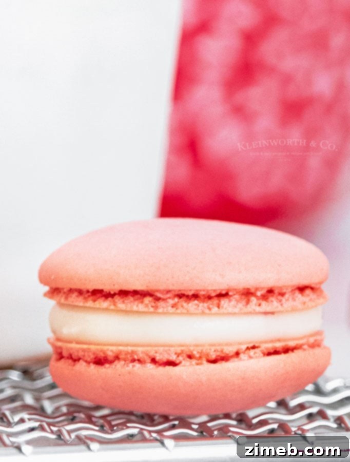 Beautiful Strawberry Macarons stacked on a plate