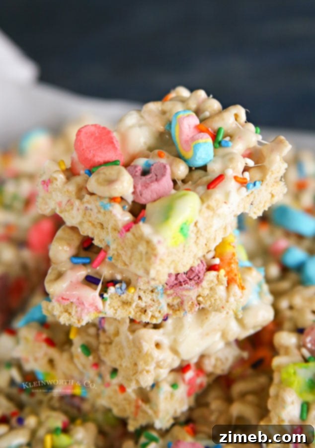 Charmed Confections 10 A pile of soft, homemade rice krispie treats with colorful Lucky Charms cereal.