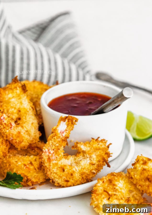 Crispy Air-Fried Coconut Shrimp 8 Plate of Air Fryer Coconut Shrimp ready to be enjoyed, highlighting its appetizer potential.