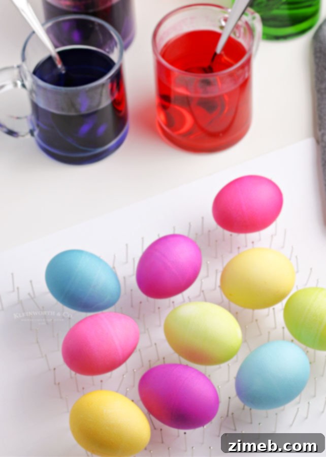 The Art of Vibrant Egg Dyeing 11 A selection of colorful Easter eggs drying on a wire rack after being dyed