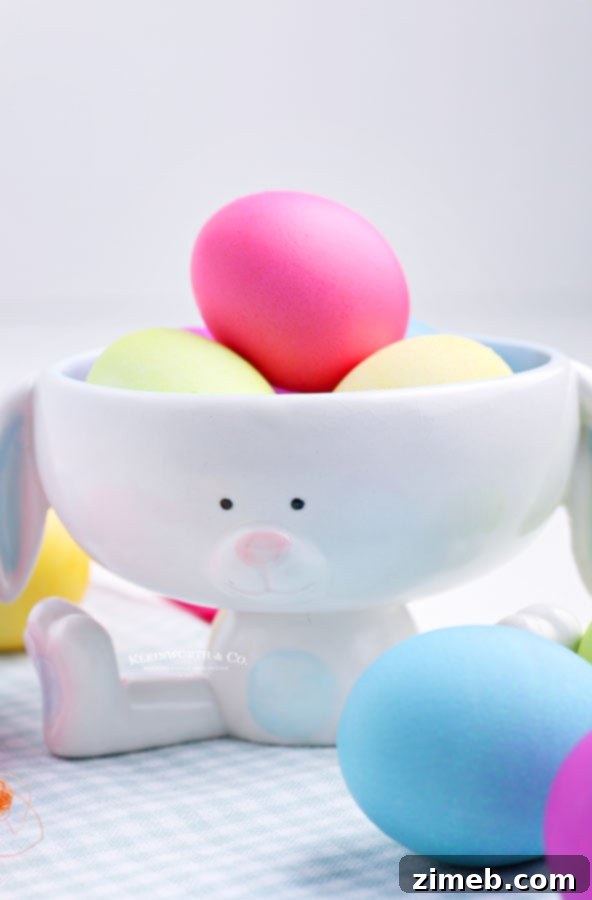 The Art of Vibrant Egg Dyeing 7 Beautifully dyed Easter eggs displayed in a decorative bunny bowl