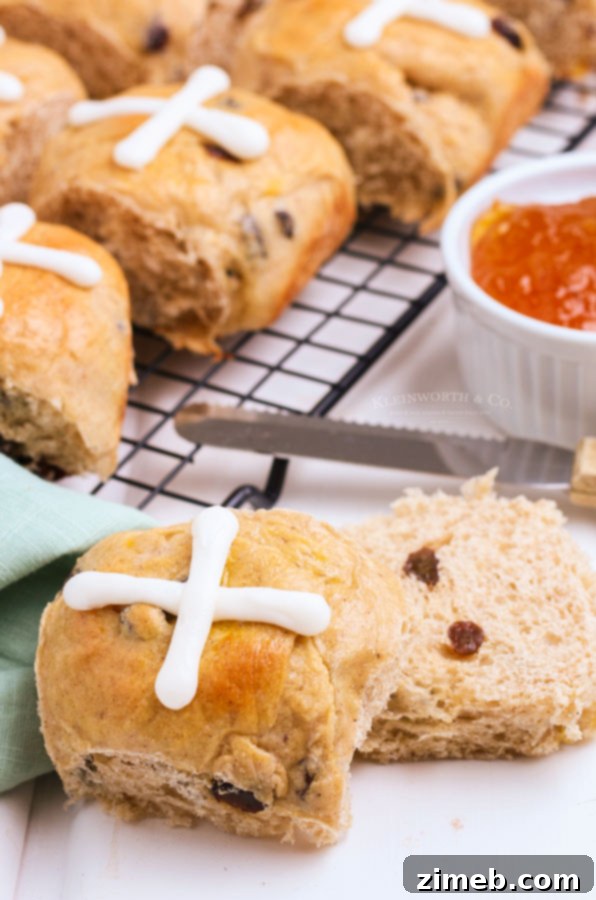 Delicious cross rolls with plump raisins, ready to be glazed for a traditional Good Friday treat.
