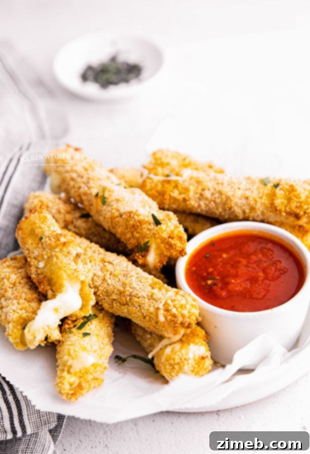 Crispy Air Fryer Mozzarella Sticks 3 cheese sticks with marinara