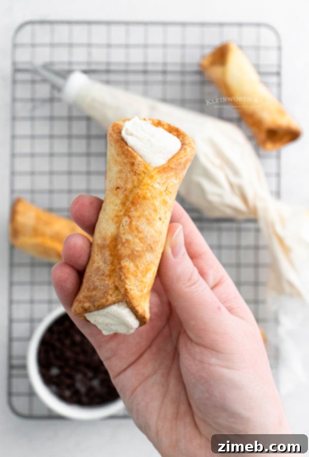 Crispy Air-Fried Cannoli 6 Adding the Cannoli Filling - Piping creamy ricotta into shells