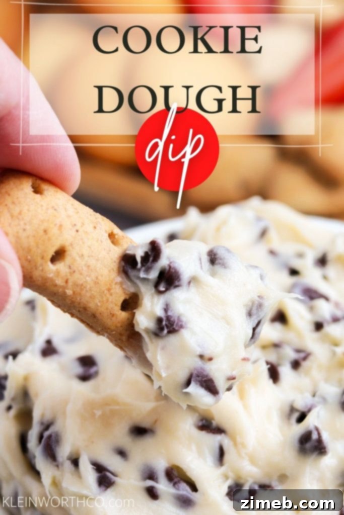 A vibrant, creamy Cookie Dough Dip, perfect for dipping. This quick and easy no-bake dessert is ready in 5 minutes and is ideal for parties. It features an irresistible blend of sweet flavors and is egg-free, making it a safe and delicious treat. Served in a white bowl, surrounded by various dippers.