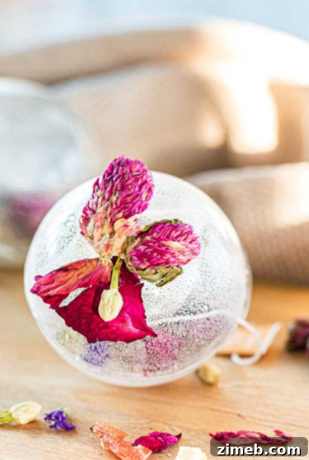 Craft Your Own Tea Bombs 3 Clear tea globe filled with tea bags and edible flowers