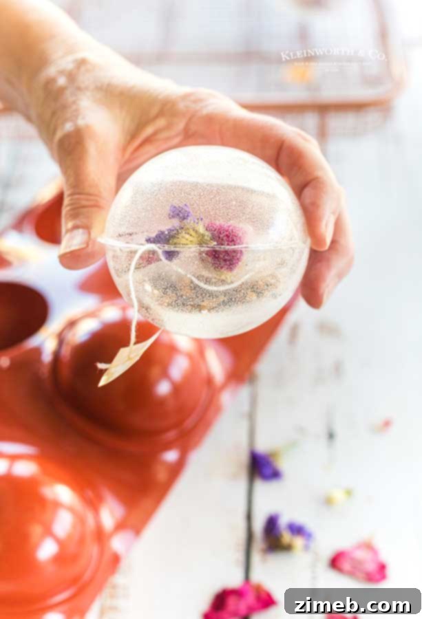 Craft Your Own Tea Bombs 8 A single clear tea globe, showcasing its delicate structure