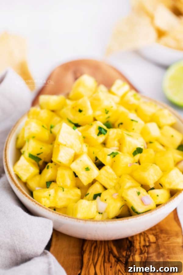 Tropical Pineapple Salsa 5 Pineapple and mango salsa served as an appetizer with corn tortilla chips