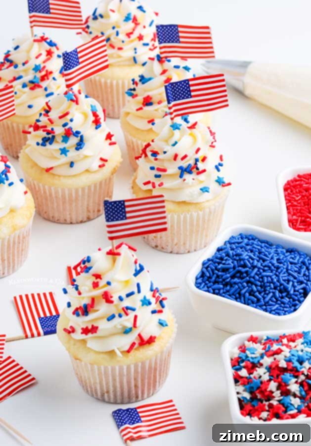 Delightful summer holiday cupcakes generously topped with colorful sprinkles.
