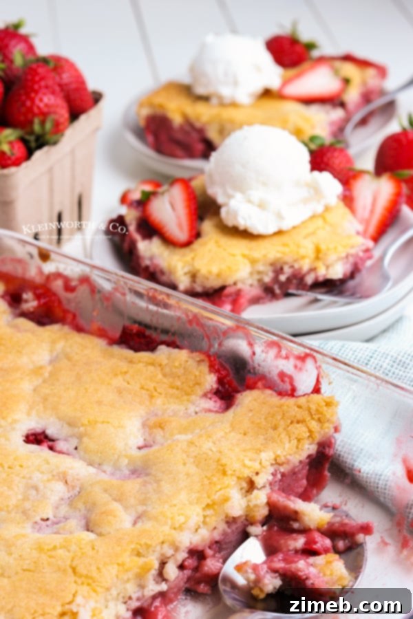 Homemade strawberry cobbler, a warm and comforting summer dessert.