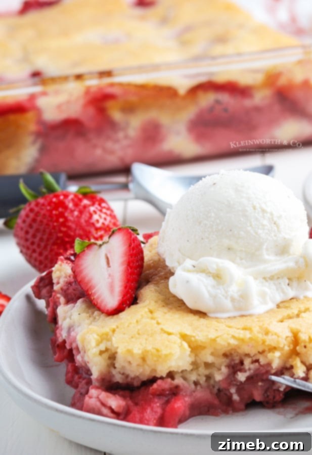 Best strawberry cobbler recipe with a buttery cake topping.
