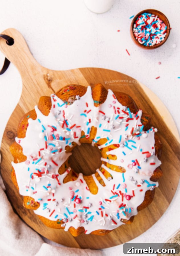 A festive 4th of July Bundt Cake, fully glazed and decorated, ready to be served.