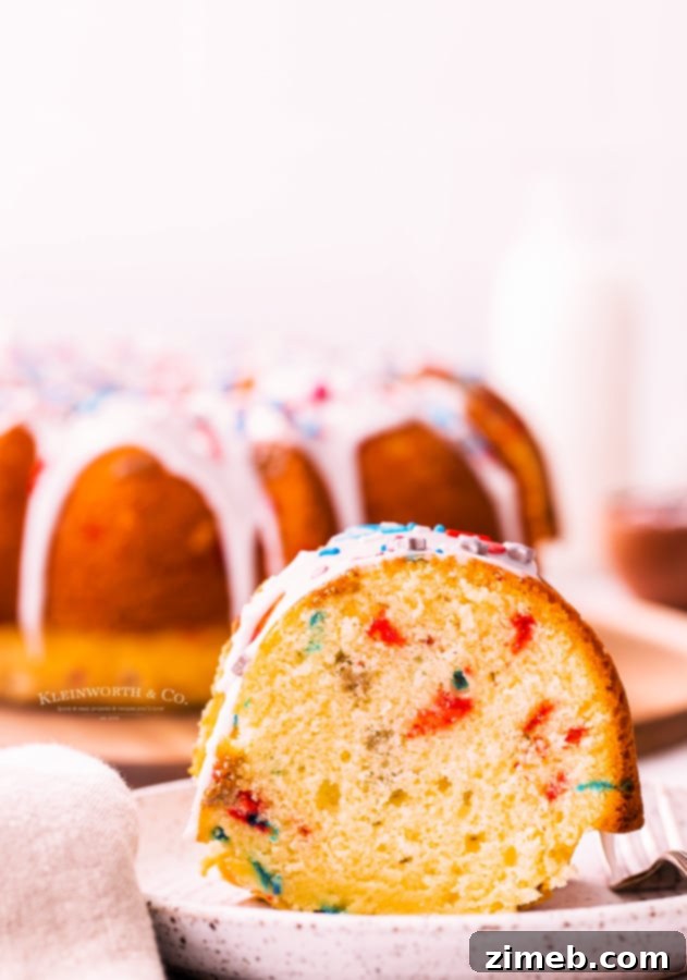 A vibrant 4th of July Bundt Cake on a decorative plate, set against a festive background for Independence Day.
