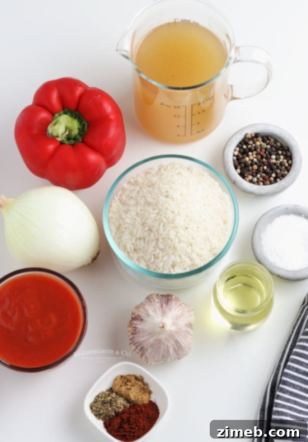 Flavorful Fiesta Rice 6 Key ingredients for making homemade Spanish Rice, laid out on a table.