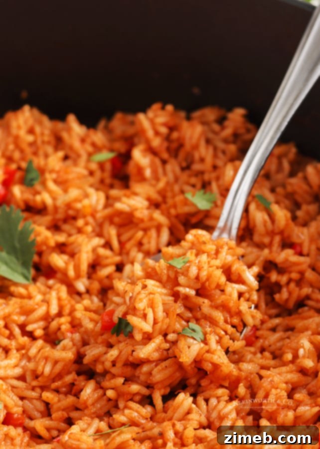 Flavorful Fiesta Rice 8 Homemade Spanish rice, a versatile and delicious side dish, served in a skillet.