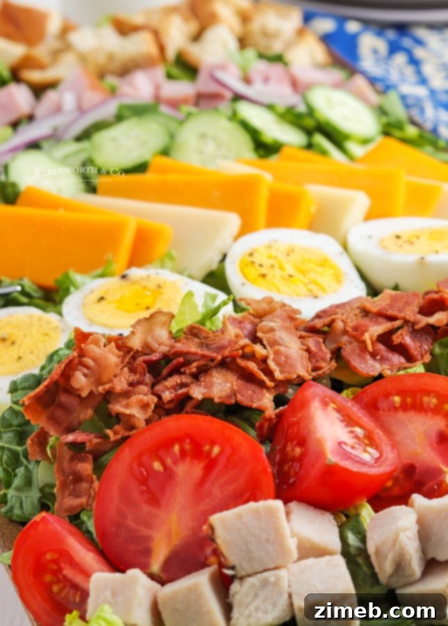 Effortless Chef Salad 16 Chef Salad with bacon, eggs, and cheese visible on top.