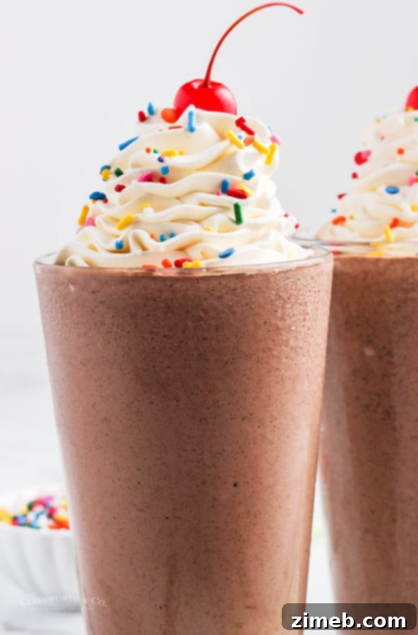 Heavenly Chocolate Milkshake 3 A refreshing chocolate milkshake, ready to be enjoyed as a sweet and satisfying drink.