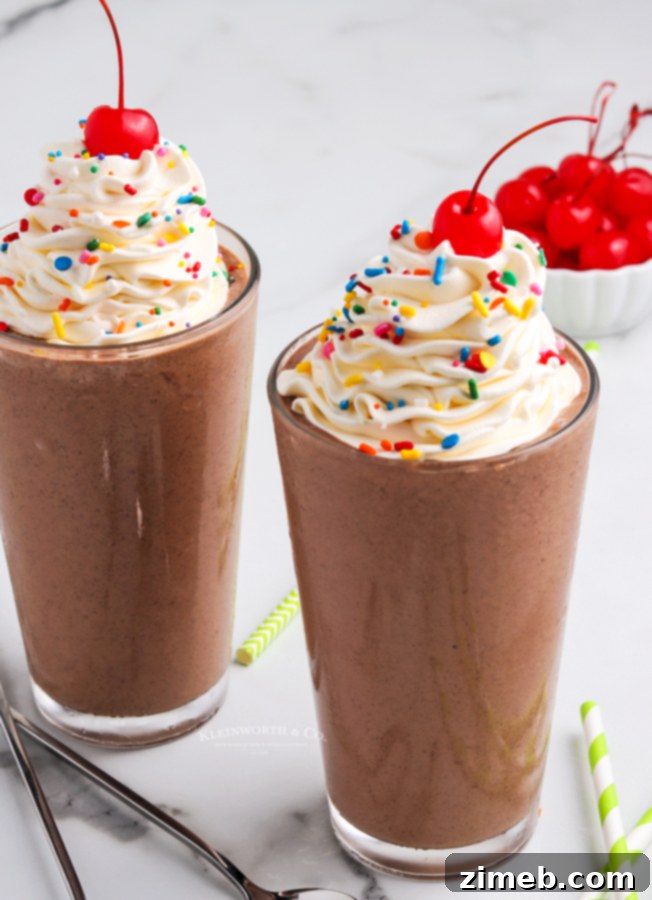 Heavenly Chocolate Milkshake 7 Delicious chocolate milkshake topped generously with fluffy whipped cream, a perfect finishing touch.
