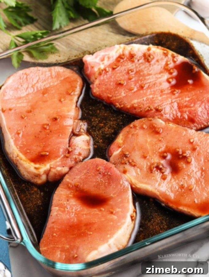Pork chops marinating in a flavorful sauce