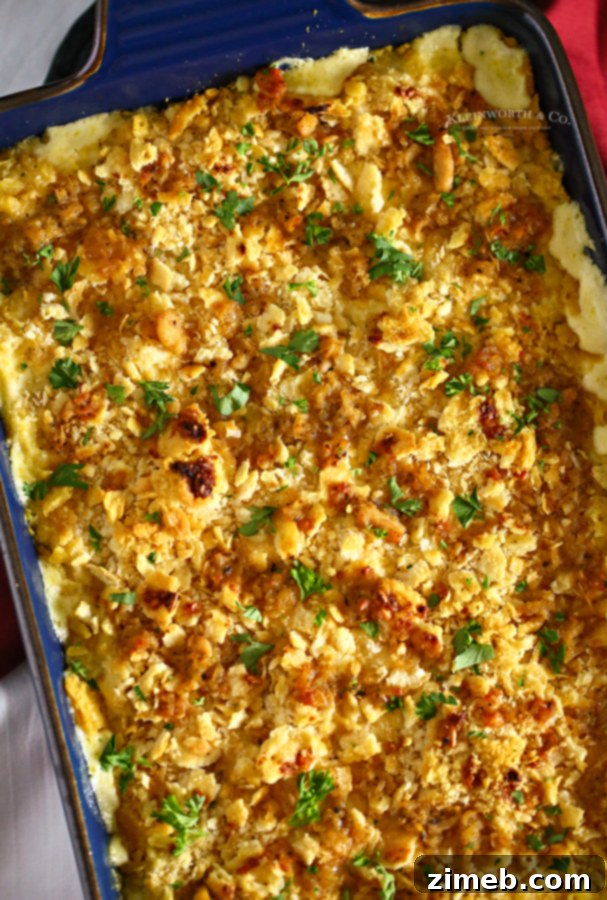 Close-up of a golden-brown Ritz Cracker topping on a chicken casserole, showing the crisp texture.