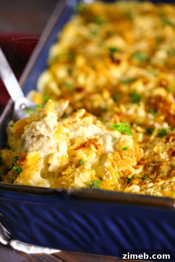 A freshly baked easy chicken casserole, golden and bubbly, with a distinct Ritz cracker crust.