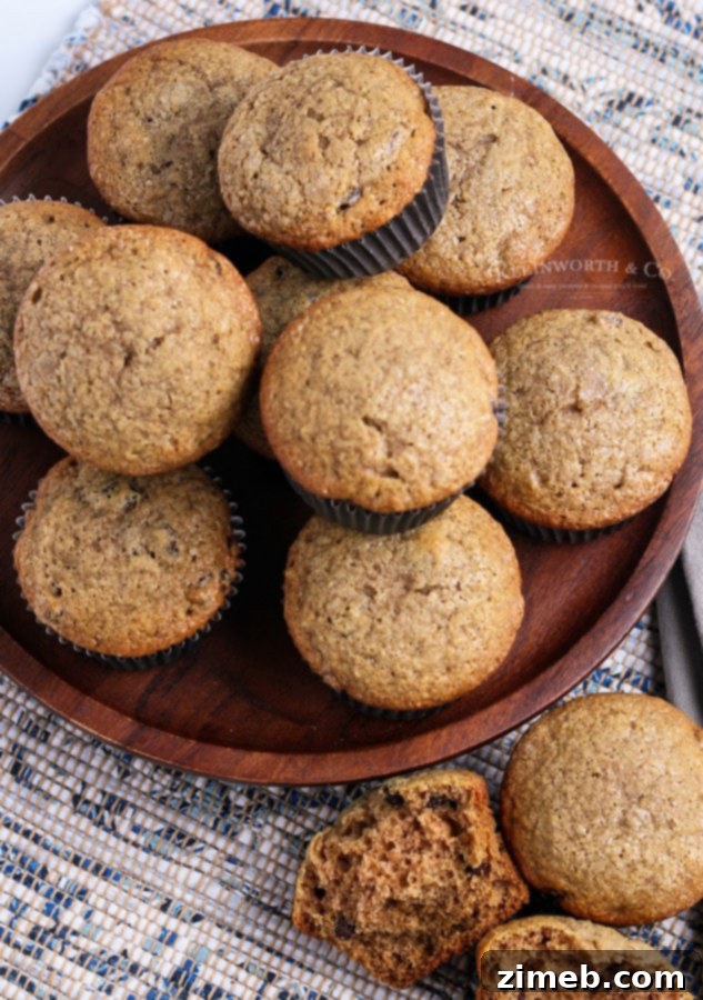 Delightful apple muffins with golden raisins, baked to perfection and stacked.