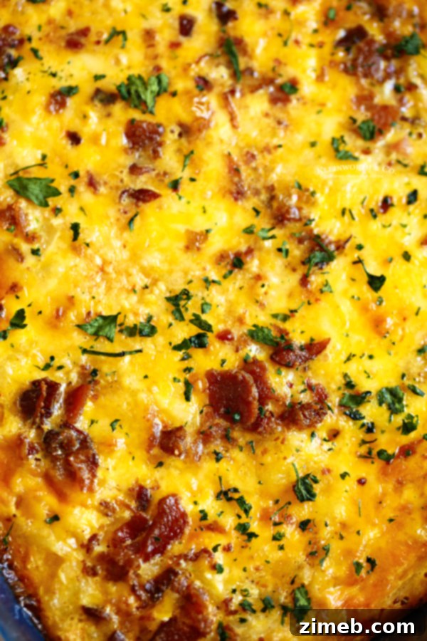 This super easy Hashbrown Breakfast Casserole is made with milk, eggs, butter, sausage, bacon, hash browns, and cheese. What a great start to the day!