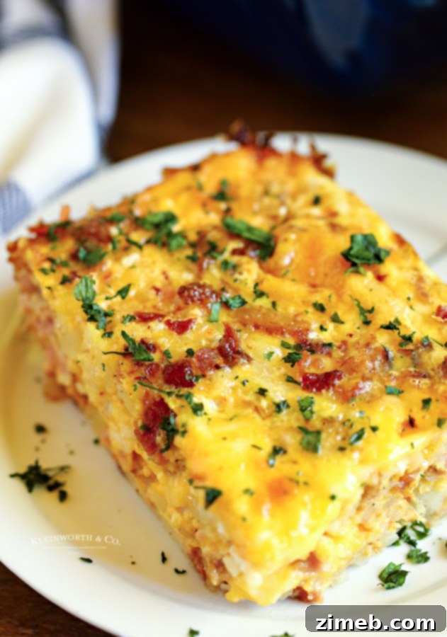 This super easy Hashbrown Breakfast Casserole is made with milk, eggs, butter, sausage, bacon, hash browns, and cheese. What a great start to the day!
